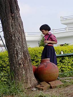girl fetching water