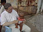 Ken Grimm with neighbor's infant