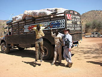 truck loaded with bales of blankets