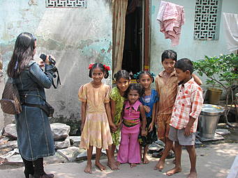 Gracey photographing children