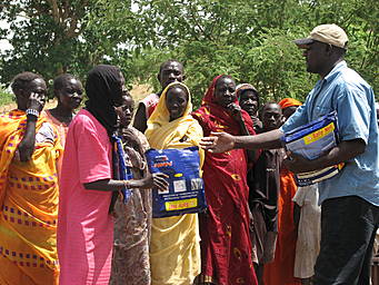 man handing packages to women
