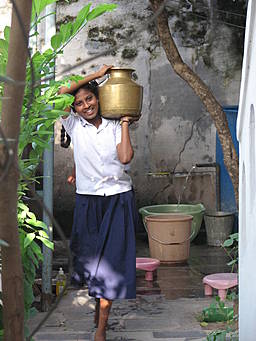 girl carrying water