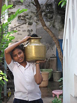 girl carrying water